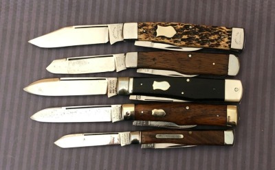 Five Gunstocks: Battle Axe, Germania, Winchester, Majestic Cutlery, and Southington
