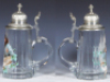 Two glass items, 8.9'' ht., clear, basket weave applied to exterior surface, screw top on bottle & woven rope handle missing; with, stein, .5L, blown, transfer & hand-painted, Dein Wohl!, pewter lid, mint. - 3