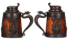 Two wood steins, metal mounts, St. Louis Silver Co., 1.0L, silver-plating worn, missing lower portion of overlay; with, .5L, silver-plating is worn. - 3
