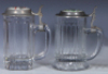 Two glass steins, .5L, pressed, clear, pressed, porcelain inlaid lid: Jung Bräu Milwaukee's Finest, base chip; with pressed, clear, porcelain inlaid lid: Old Lager, Joliet Citizens Brewing Co., Joliet, IL., mint. - 2