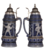 Two steins, pottery, 2.0L, 15.4" ht., 452, Diesinger, relief, pewter lid is damaged, 3" hairline; with, 2.5L, 14.8" ht., marked J.W. Remy, 146, relief, new pewter lid, good condition. - 3