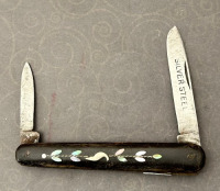 Abalone inlaid sleeveboard