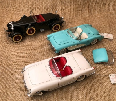 Three Franklin Mint Die Cast Cars
