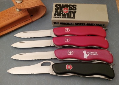 Four Victorinox Swiss Army Knives
