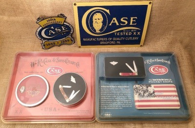 Two Case Signs and Two Commemorative Case Folders in Tins