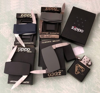 Four Zippo Money Clip Knives and a Lighter