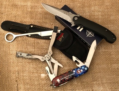 Smith & Wesson, Schrade Tough, Victorinox Swiss Army Knife, and a Trout knife