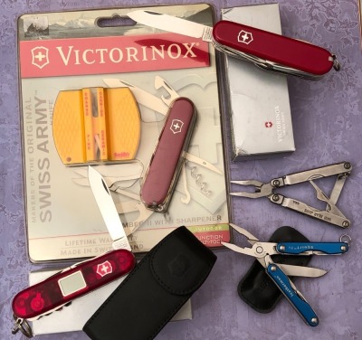 Three Victorinox, One Leatherman and a Mini Bear Jaws Multitool