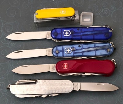 Four Swiss Army Knives and a Metal Utility