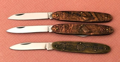 Three Relief handled Metal Folders