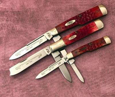 Trio of Case Red bone Centennials: Two Gunstocks and a One Arm Man