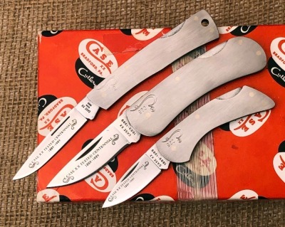 Three Case Centennial Metal Lockbacks
