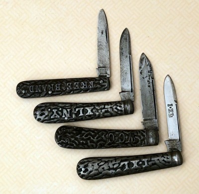 Four Vintage Metal Relief Folders, Boker, Western, I*XL and Ulster