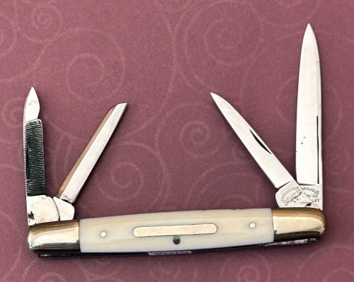 Cattaraugus Exhibition White Bone Four Blade Equal End