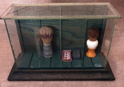 Glass Display with Two Shave Brushes, Cattaraugus razor blades and Cattaraugus Metal stamp